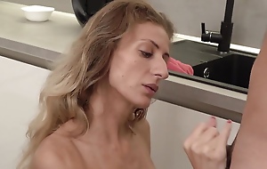 Skinny Mature Blonde Serves up Her Tight Ass to Get Fucked on the Kitchen Deterrent
